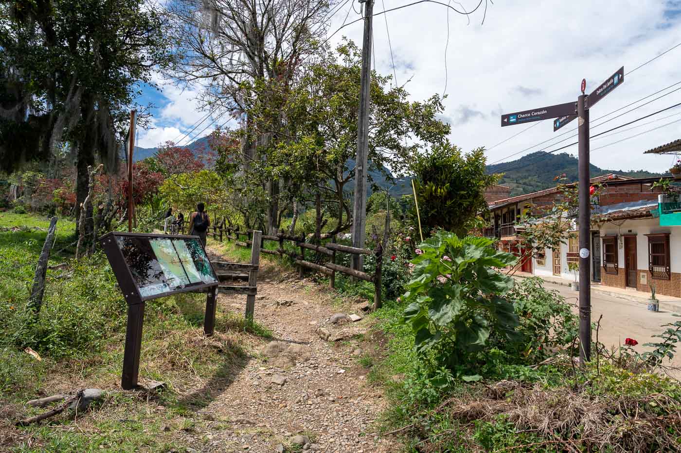 The trailhead signs at the beginning of a rock Camino de la Herrera trail in Jardin.