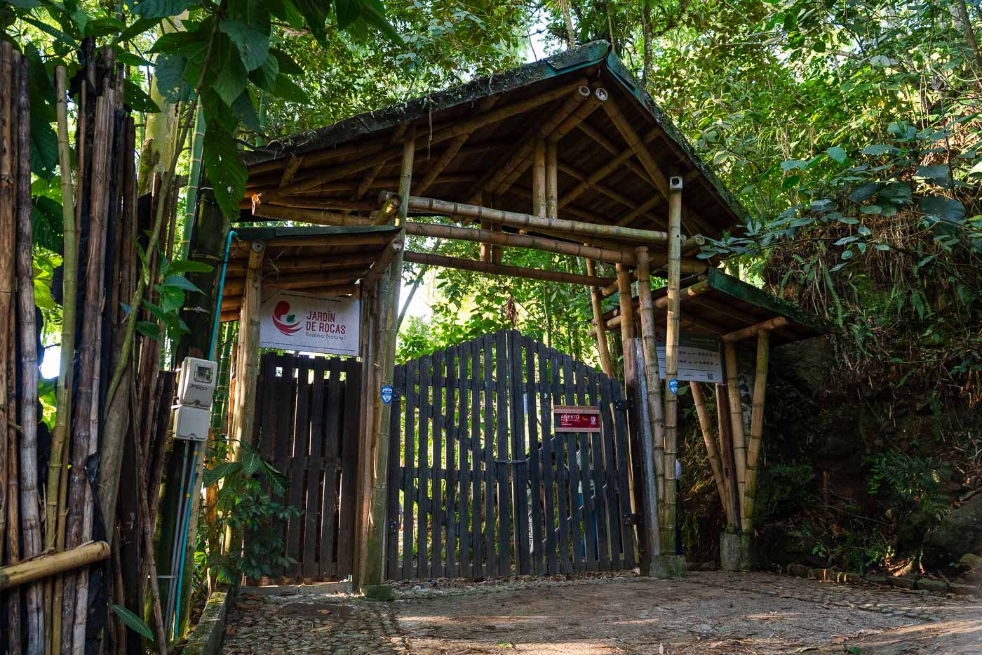 The wooden and bamboo entrance gate to the Jardin de Rocas nature reserve.