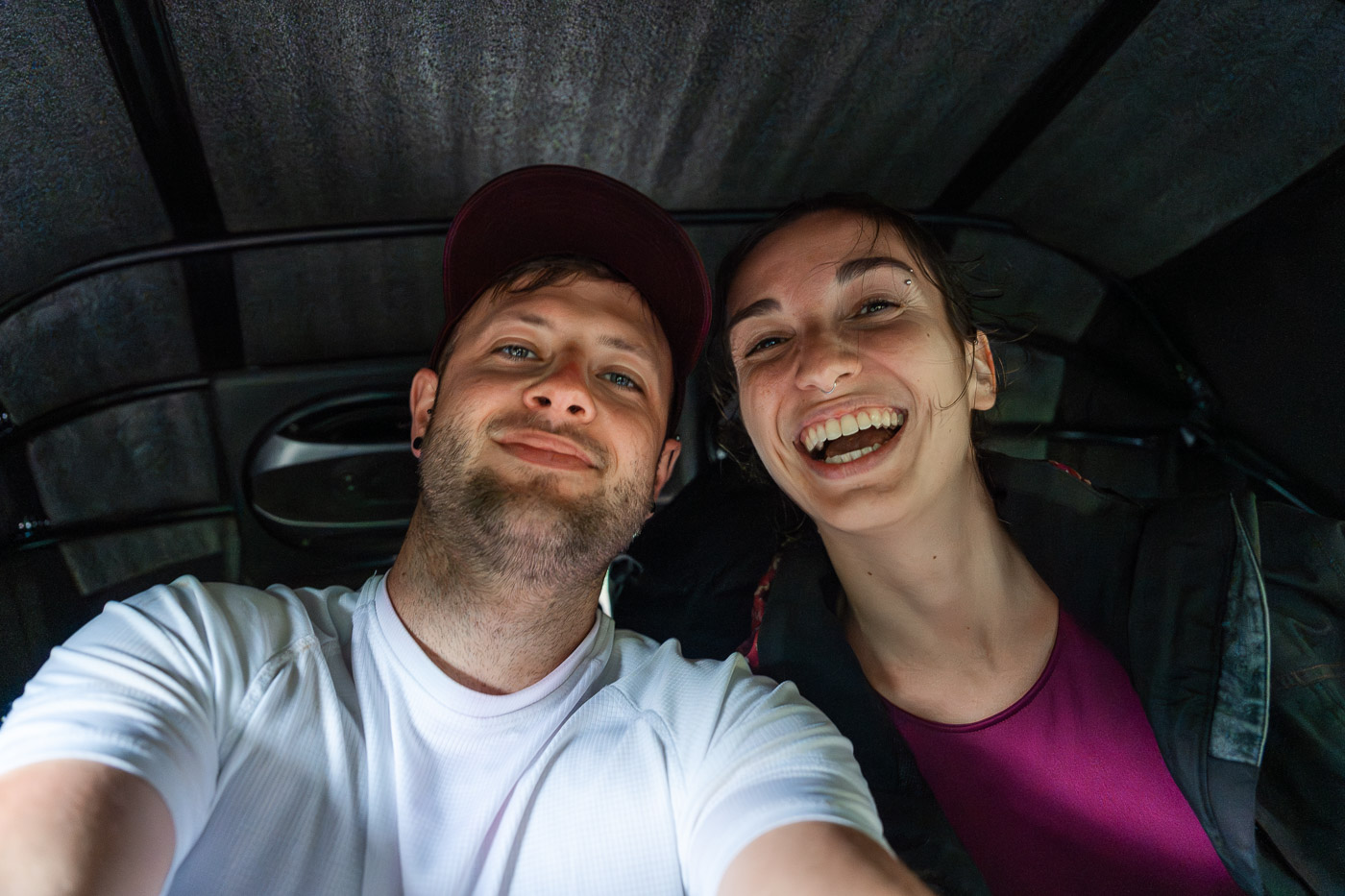 A selfie of Ryan and Sara riding in the back of a tuk tuk.
