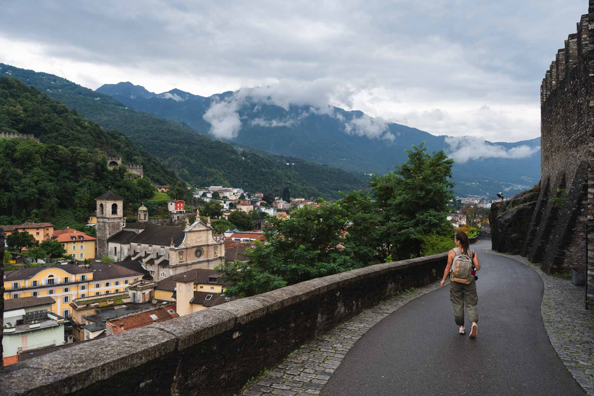 Sara walkng down the and old stone road leading from Castle Grande to Bellinzona town in Switzerland.