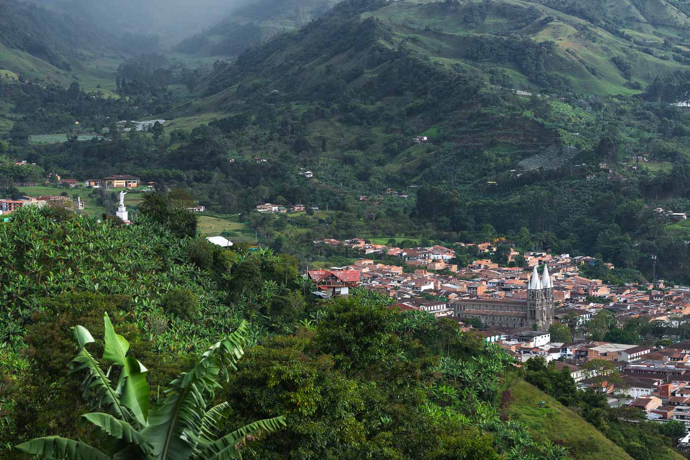 The view over Jardin town and the basilica in a valley in the Andes from Cafe Jardin.