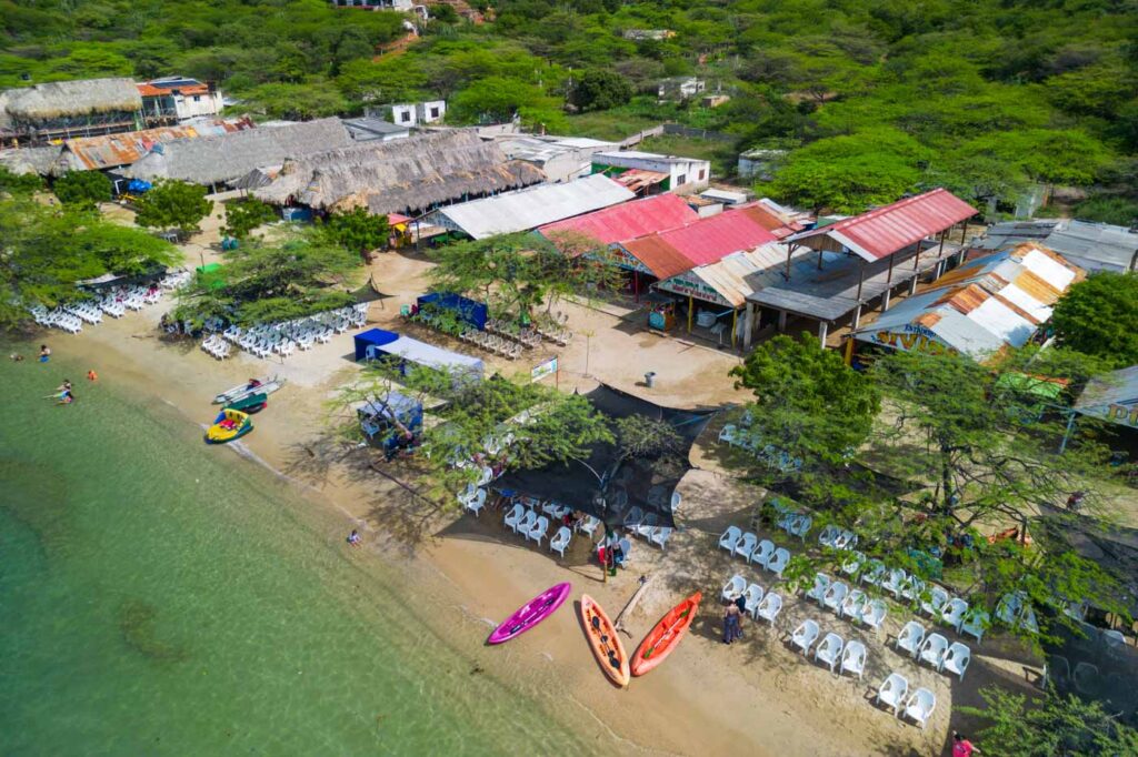 Chairs, kayaks and restaurants on Playa Grande.