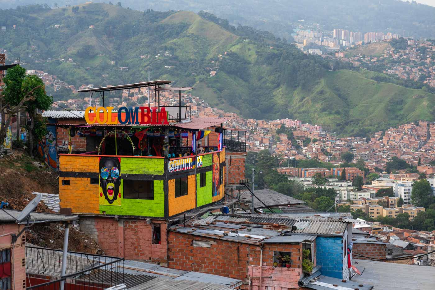 A colourful bar in Comuna 13 overlooking the rest of Medellin city.