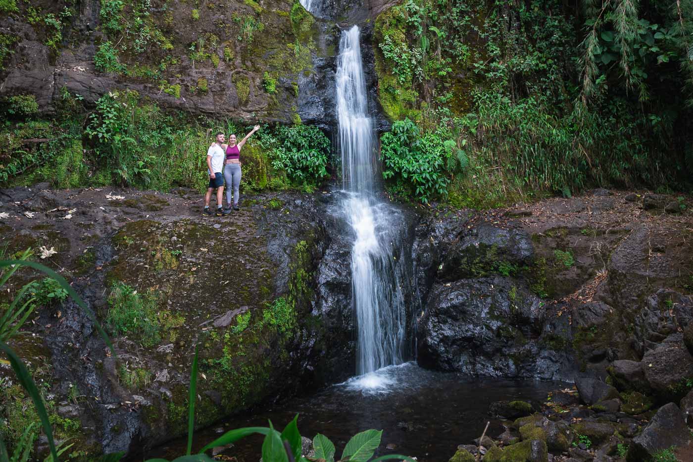 Sara and Ryan posing next to the Fall of the Dragon waterfall.