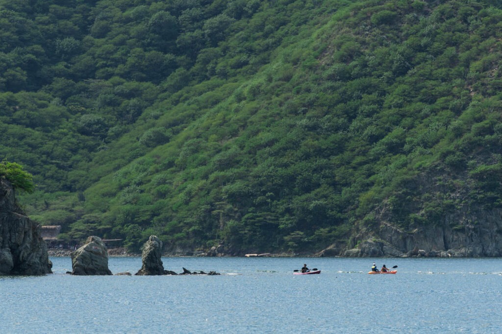 Kayakers exploring Playa Grande and Playa Taganga bay.