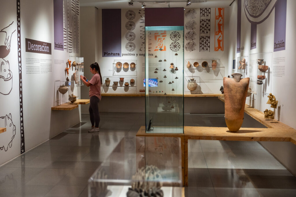 Sara looking at ceramic displays inside the Museum of Antioquia in Medellin.