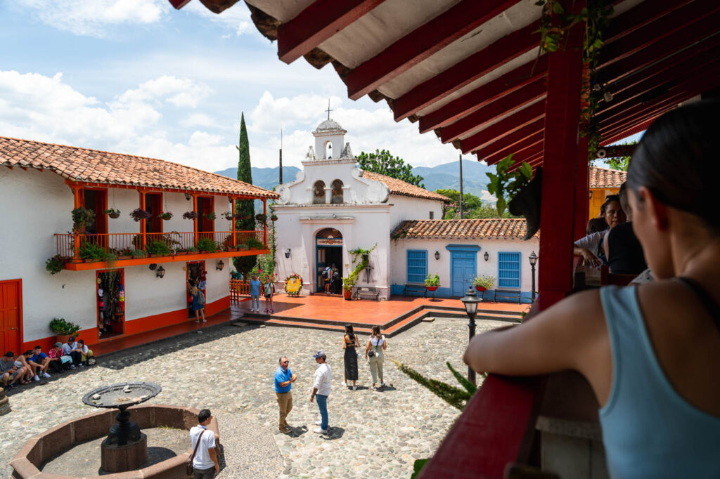 Sara overlooking the main square of Pueblito Paisa from the restaurant balcony. Sara overlooking the main square of Pueblito Paisa from the restaurant balcony.