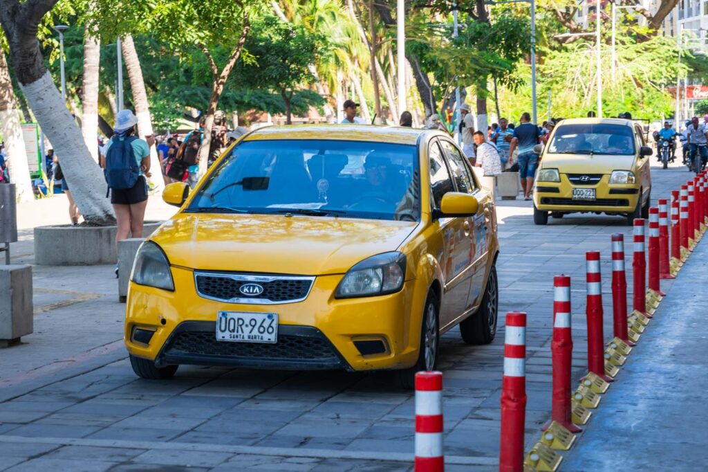 Taxi's driving along Rodadero promenade.