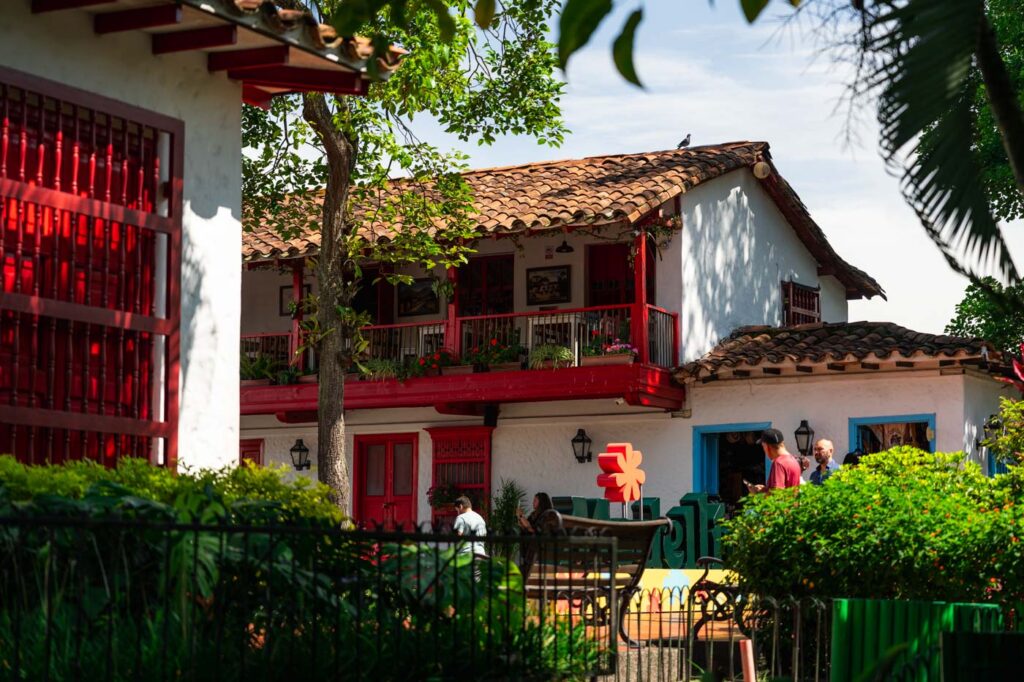 Colourful, traditional Antioquian buildings surrounded by greenery in Pueblito Paisa.