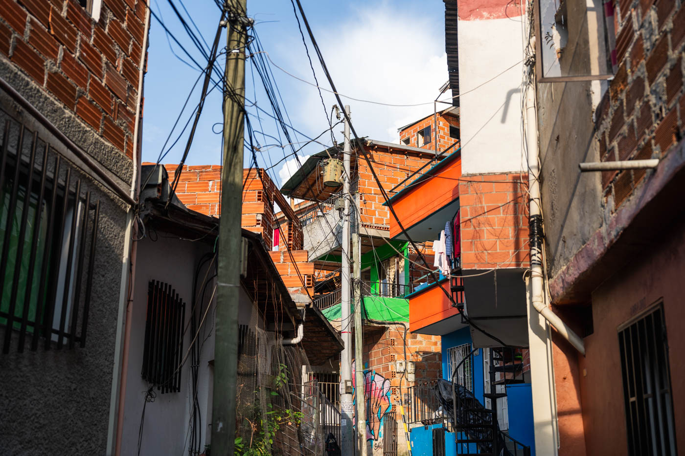 Wires snaking through a small alley in Comuna 13.
