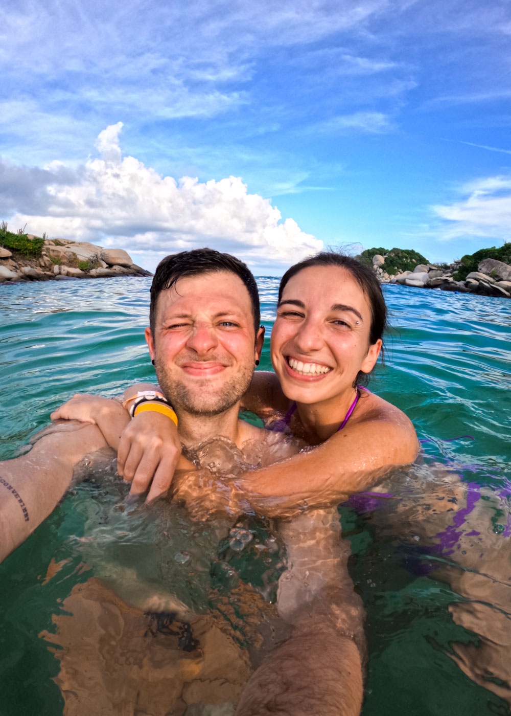 Ryan and Sara taking a selfie while swimming in the Caribbean sea at Cabo San Juan.