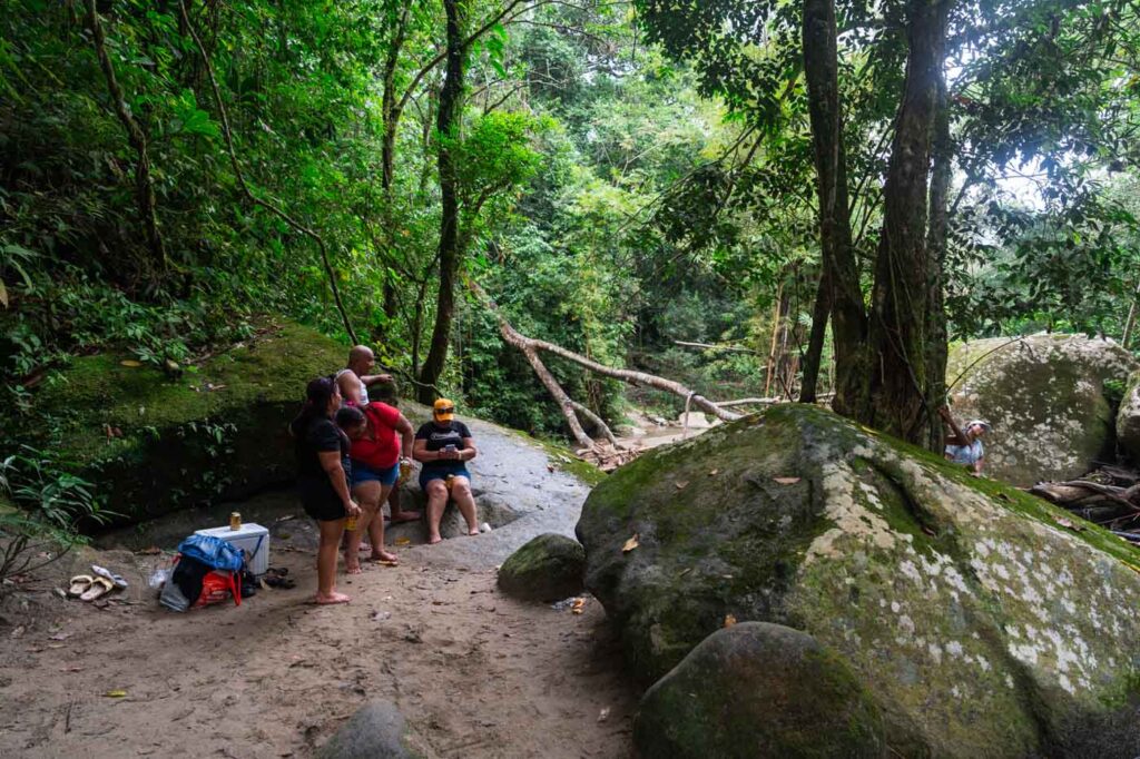 Local Colombian family in the forests of Minca with a cool box. Local Colombian family in the forests of Minca with a cool box.