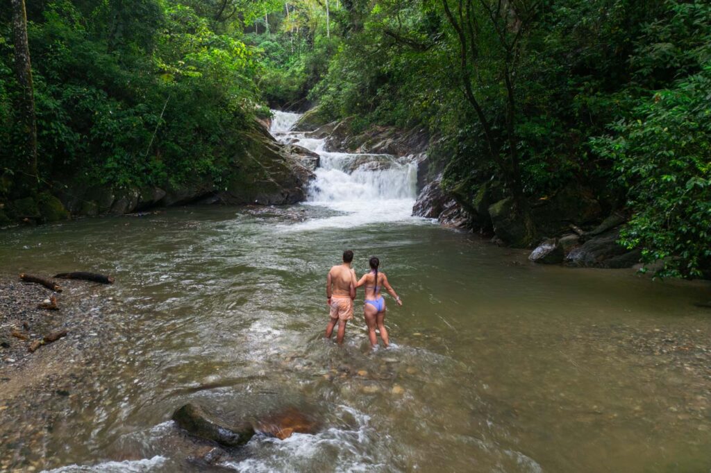 Ryan and Sara paddling in the river at Pozu Azul waterfall.