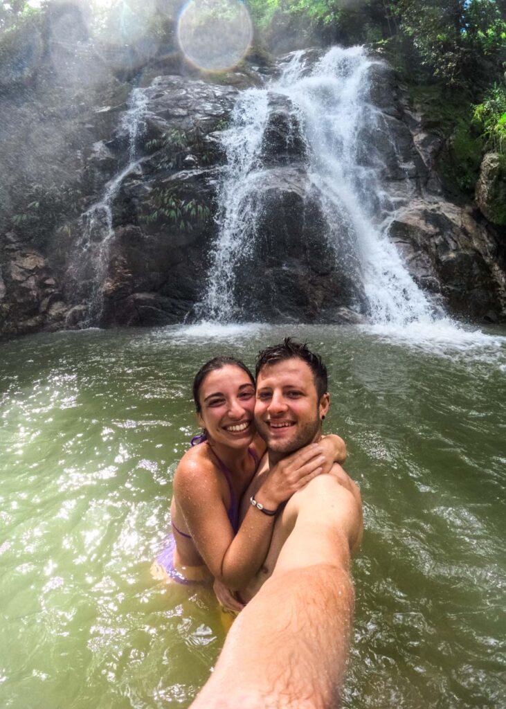Ryan and Sara taking a selfie while standing in front of Marinka Waterfall.