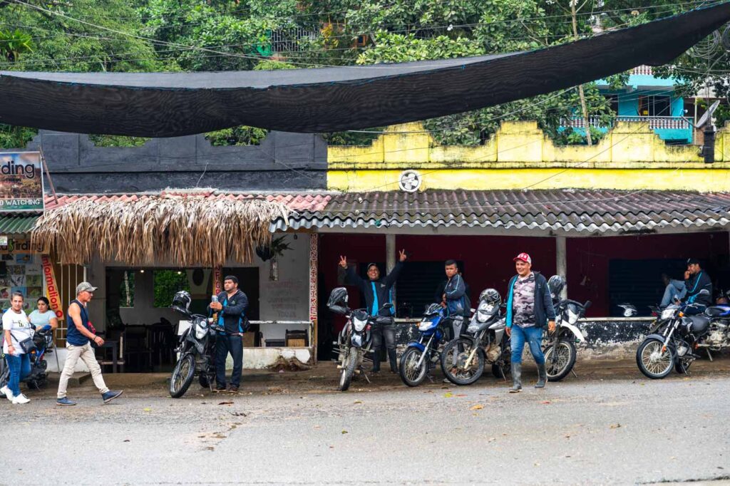 Moto taxi drivers in Minca lined up and posing for the camera. Moto taxi drivers in Minca lined up and posing for the camera.