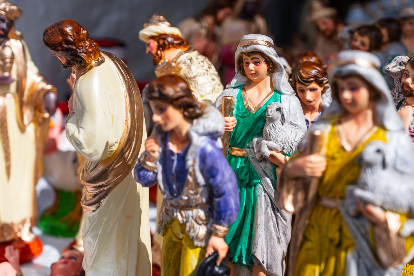 A creative photo of figures of saints for sale in a Christmas market in Cusco.