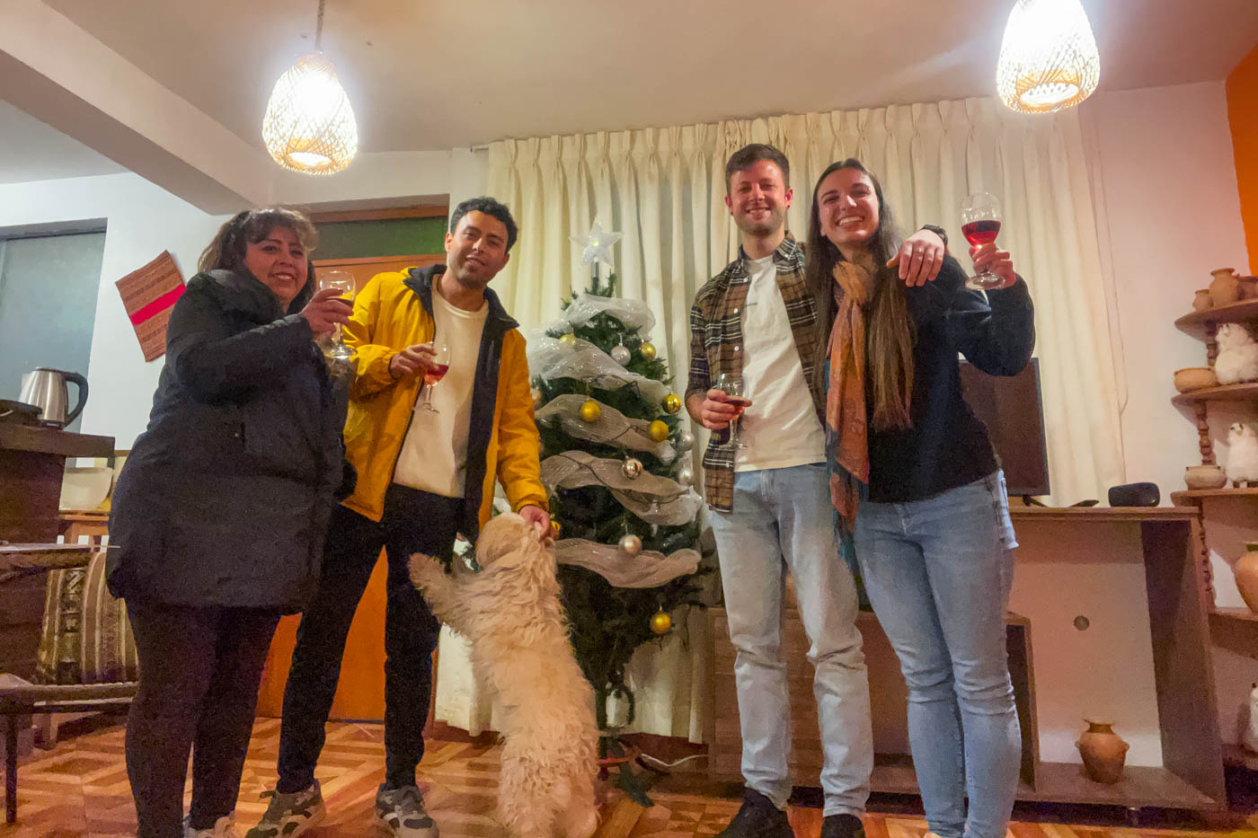 Ryan and Sara posing with Fabricio and his mum with Molly the dog on Christmas Eve in Cusco.