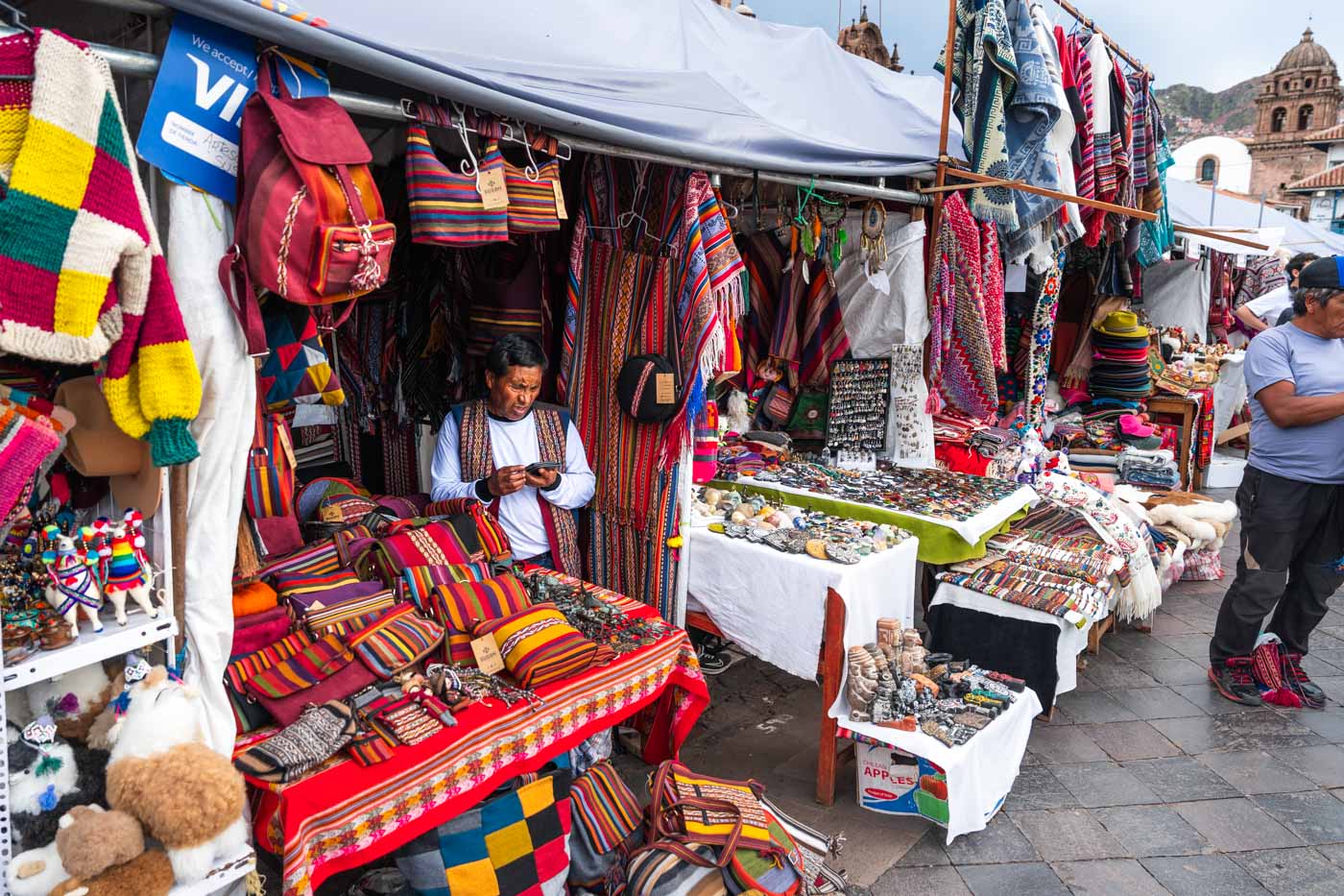 Vendors selling handmade goods at the Santuranticuy Christmas market in Cusco.
