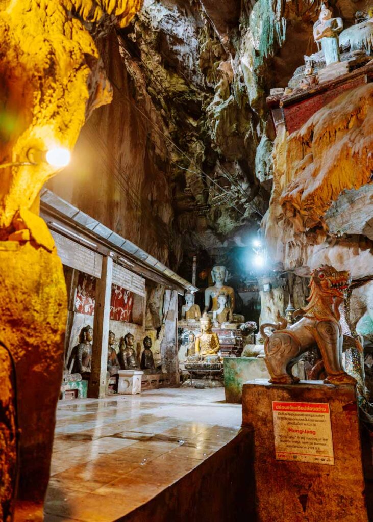 Numerous Buddhist artefacts and statues out on display inside Tham Phranon in Chiang Dao cave.